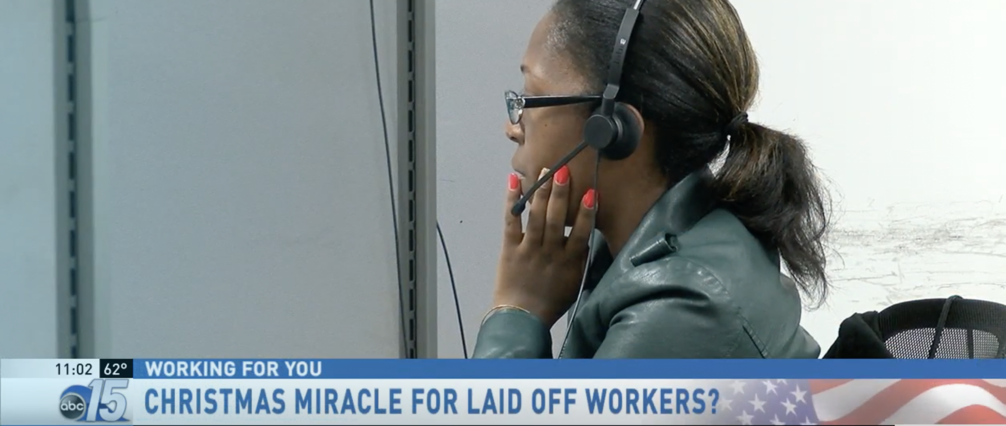 Screen capture of an abc news mention of Aventus. On screen, a black woman wearing a headset and an overlayed header: 'Christmas Miracle for Laid Off Workers?'